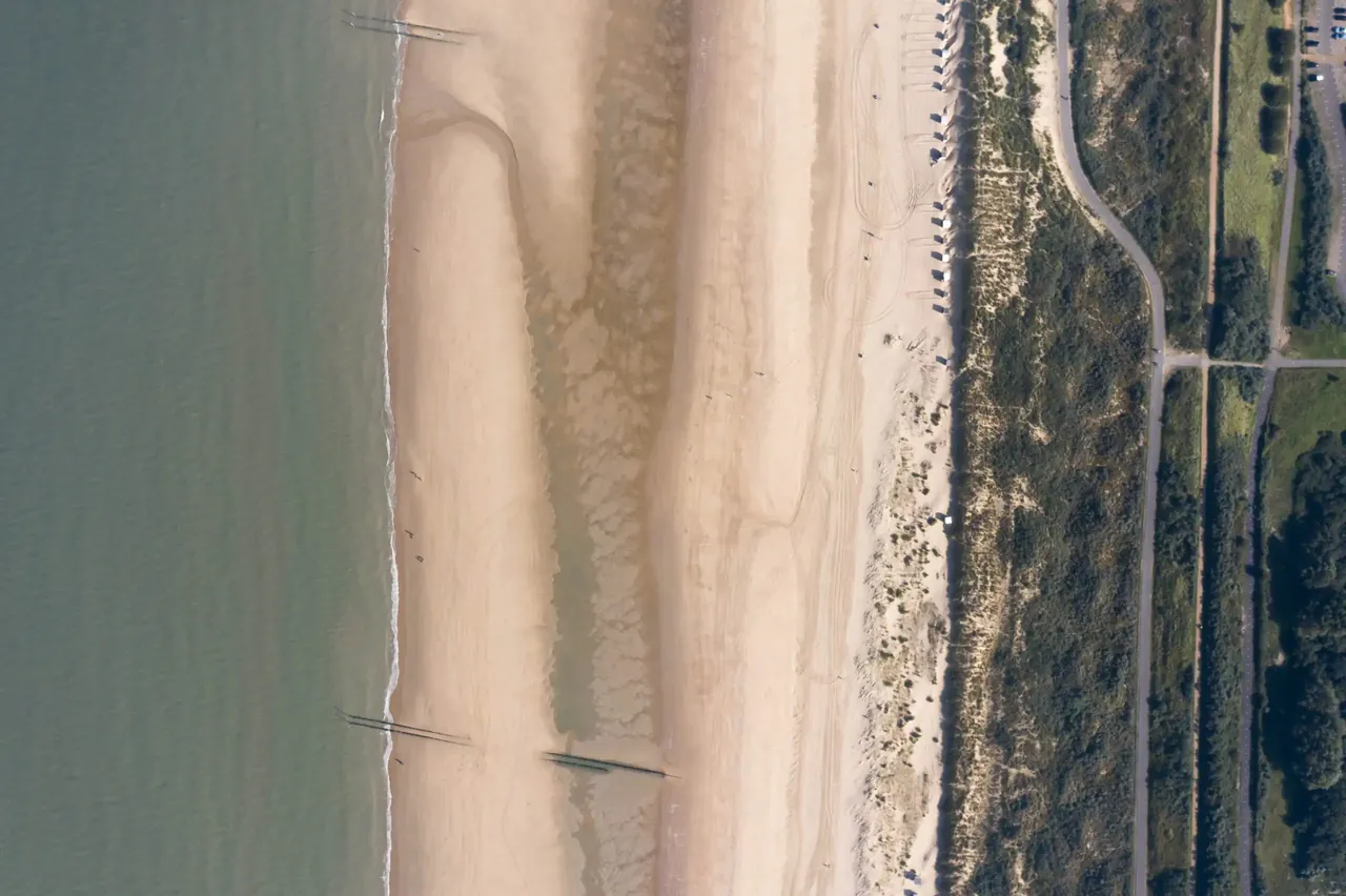 Aerial view of sea, beach and nature reserve along the route to Breskens